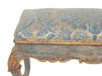 An Italian Painted and Parcel Gilt Bench with Fortuny Upholstery