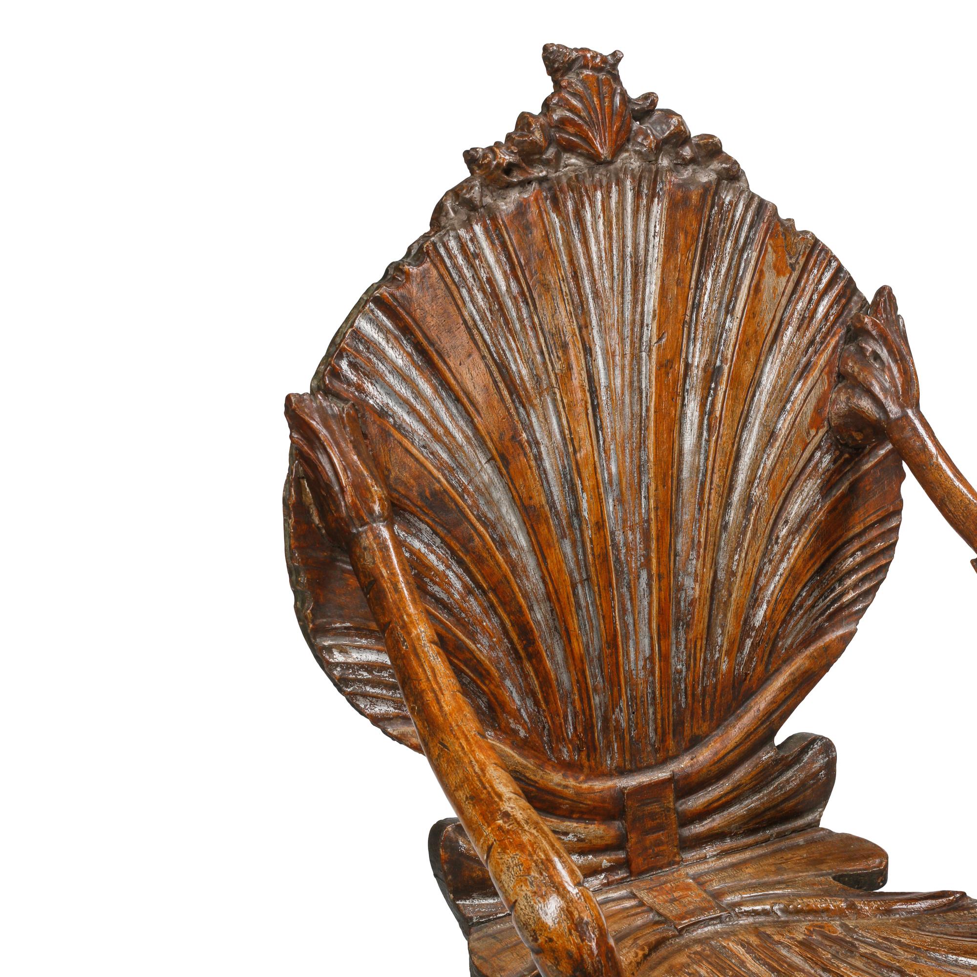 An Italian Carved Three-Piece "Grotto" Seating Suite