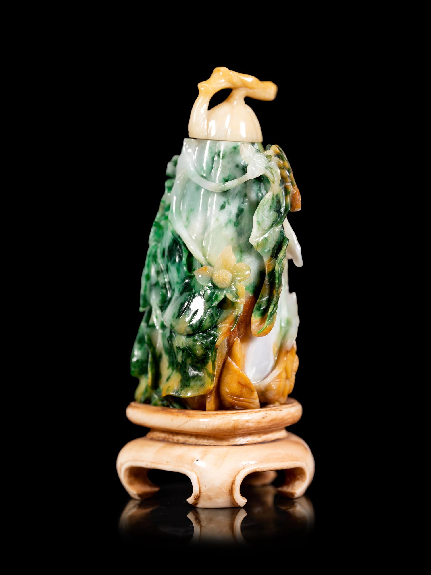 An Apple Green, Pale Celadon, and Russet Jadeite Melon-Form Snuff Bottle
