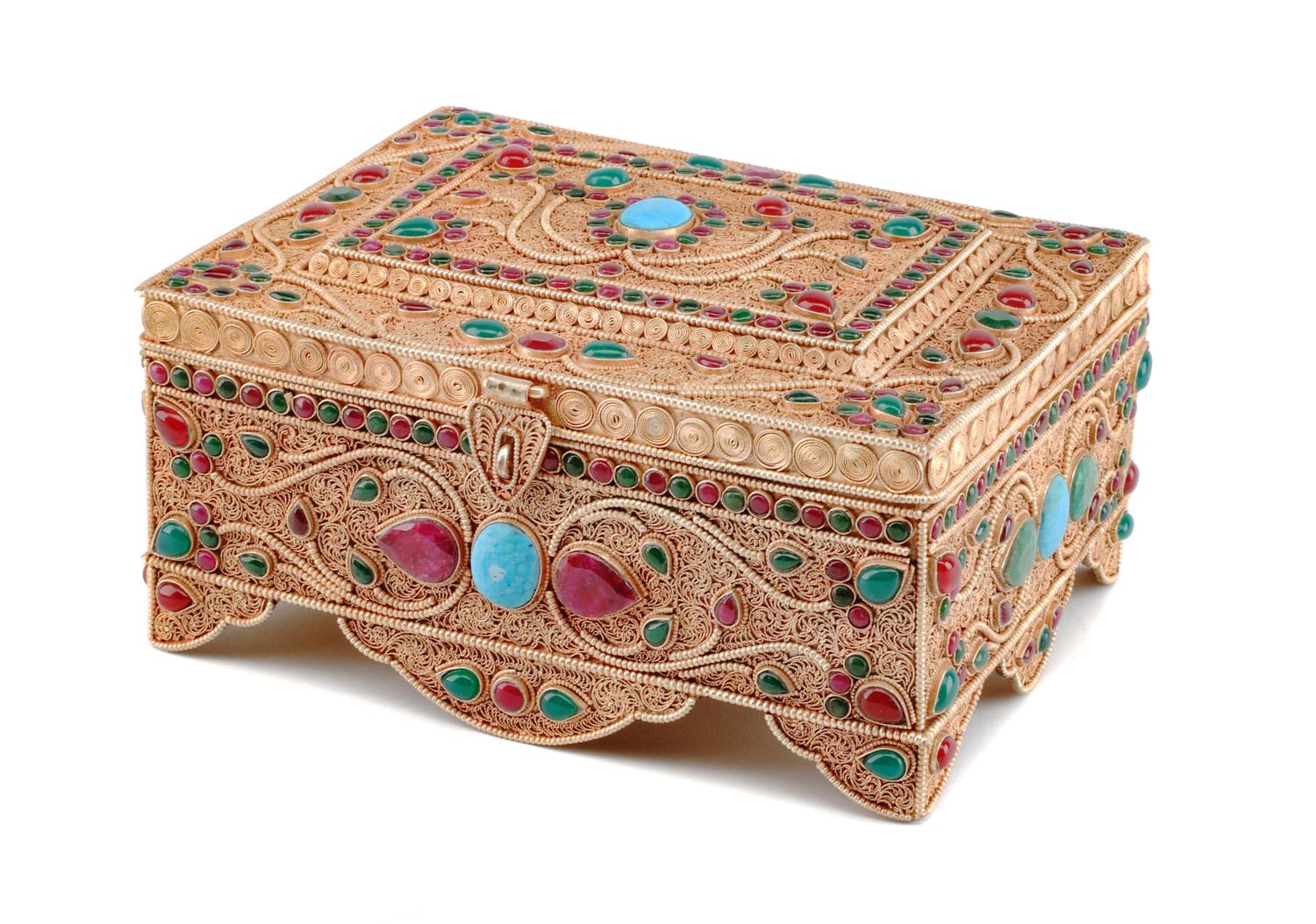 A Silver Filigree and Semi-Precious Stone-Inset Box, 20th Century, of rectangular form with stylized floral decoration.