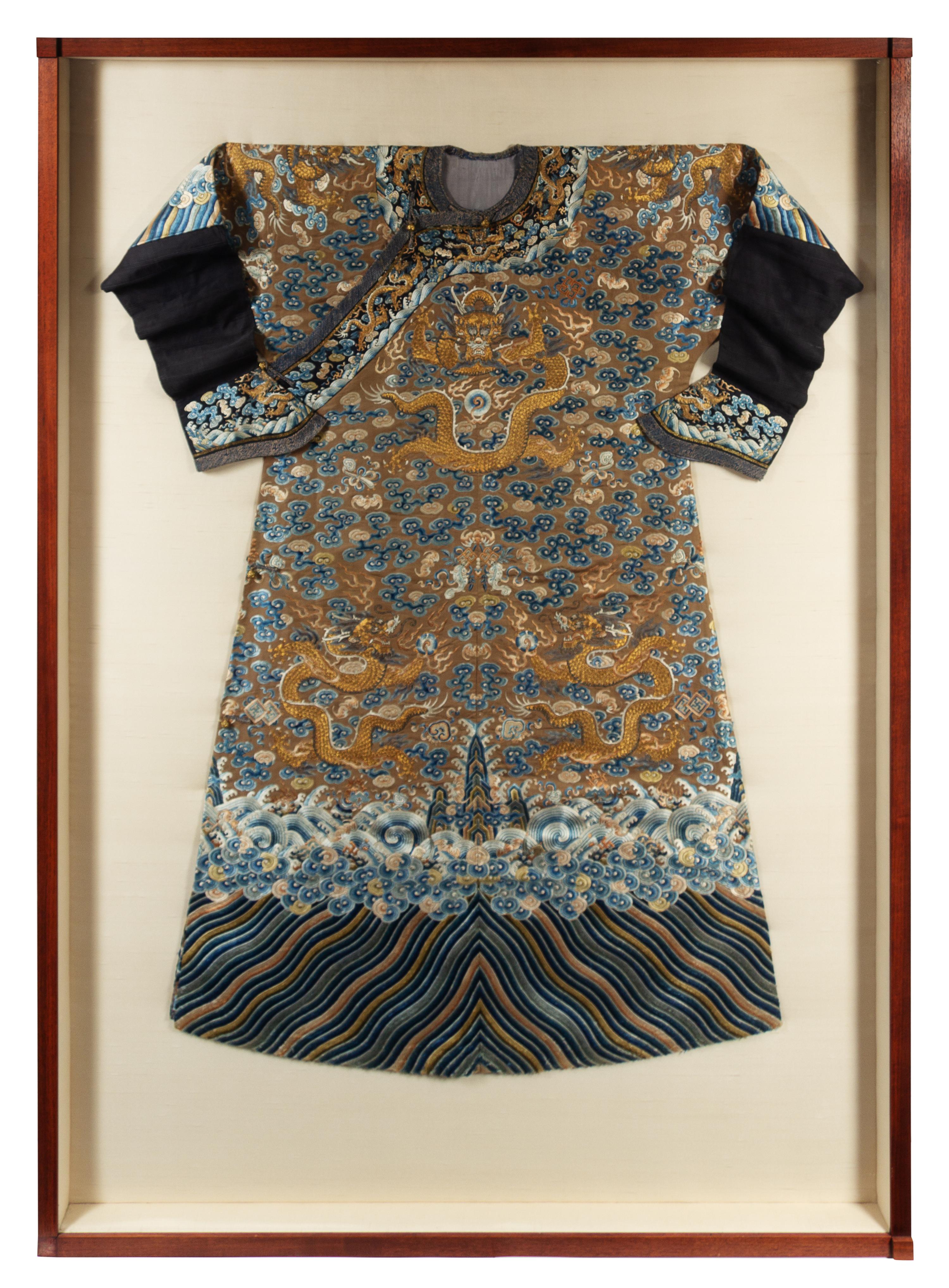 A Chinese Embroidered Silk Brown Ground Dragon Robe, Jifu Approximate height collar to hem 56 inches. — 19TH CENTURY