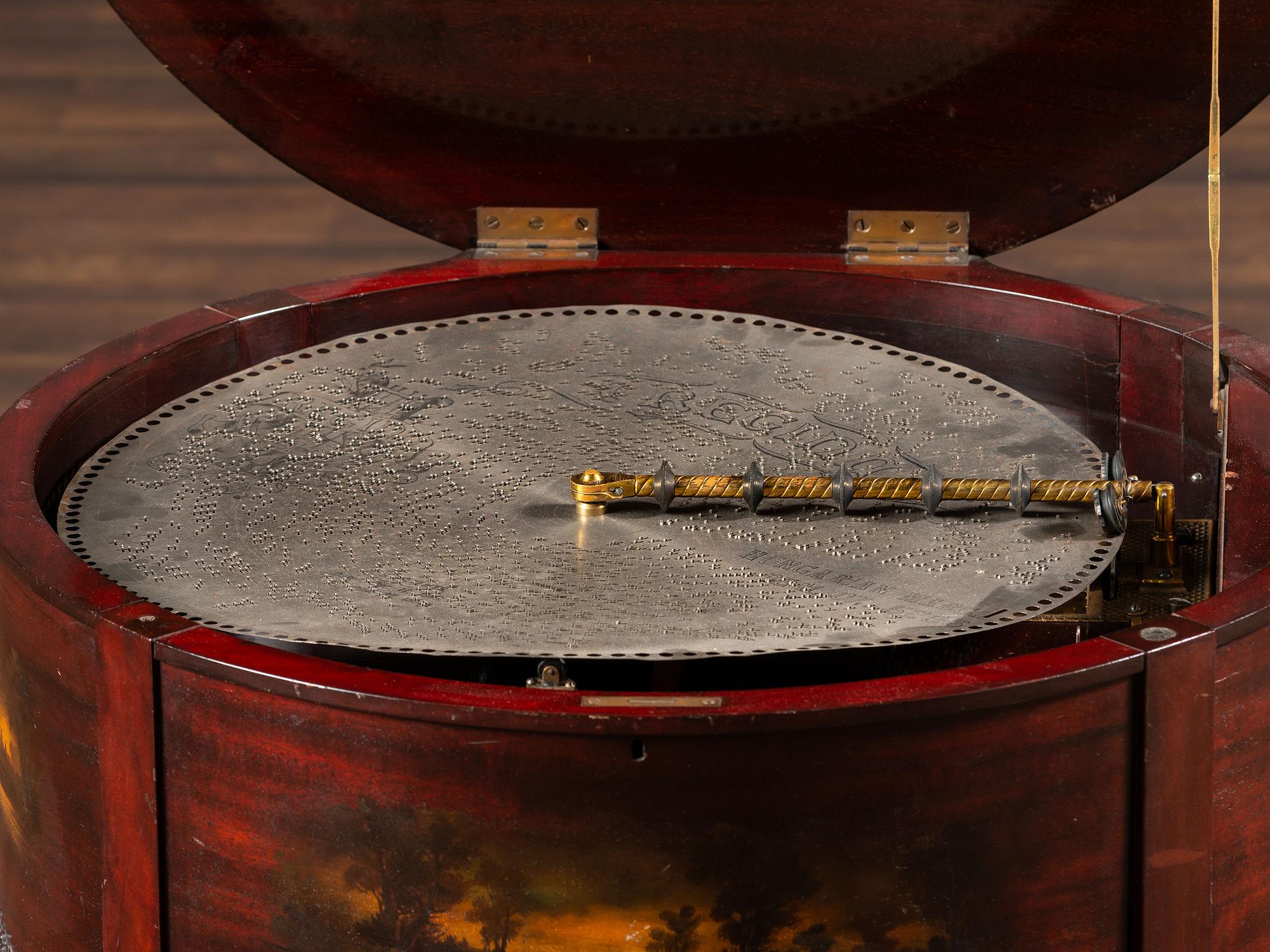 A Regina 'Rookwood ' Paint Decorated 20 Inch Drum Music Box
