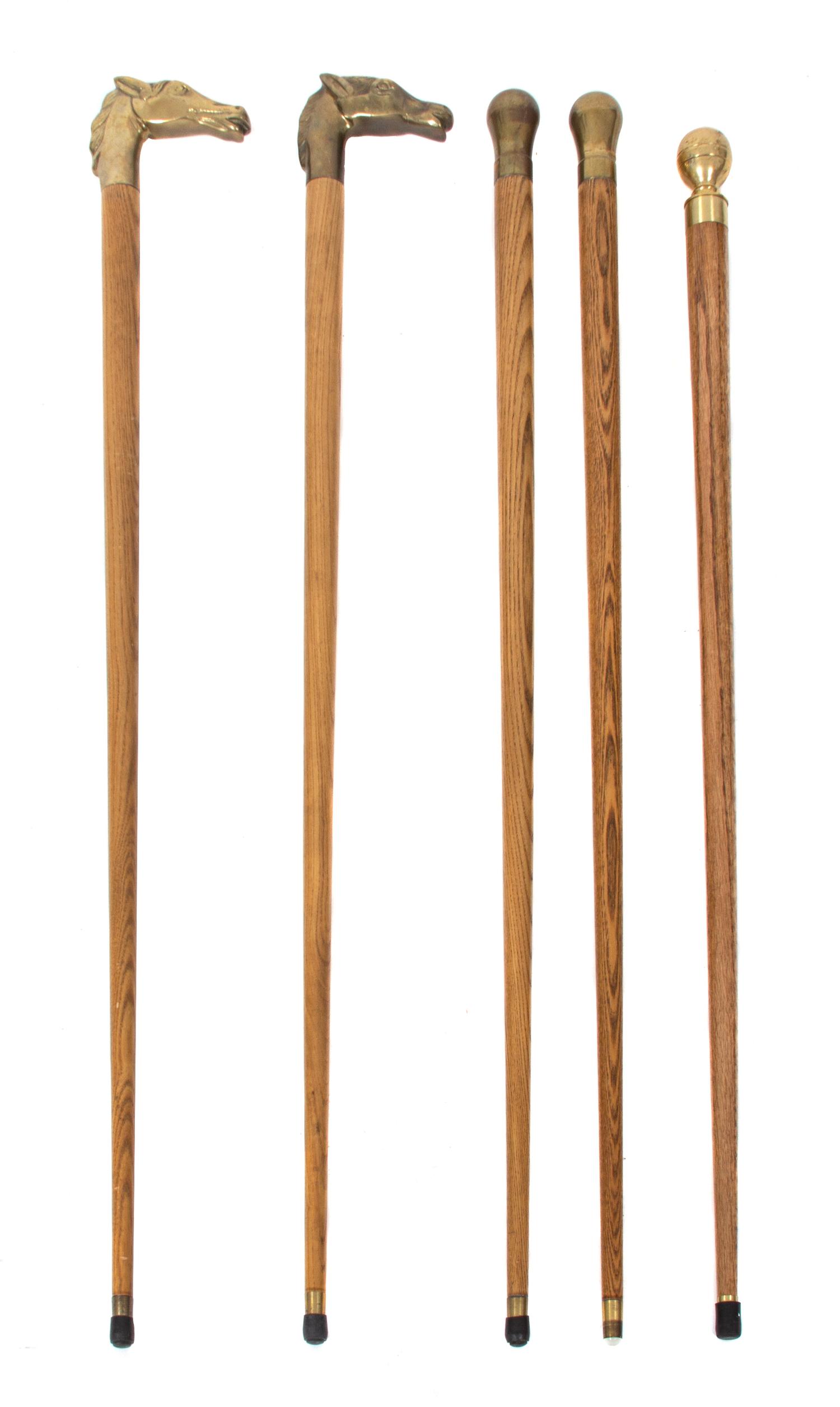 A Collection of Five Brass Handled Ash Canes Length of tallest 35 1/2 inches. — 20TH CENTURY