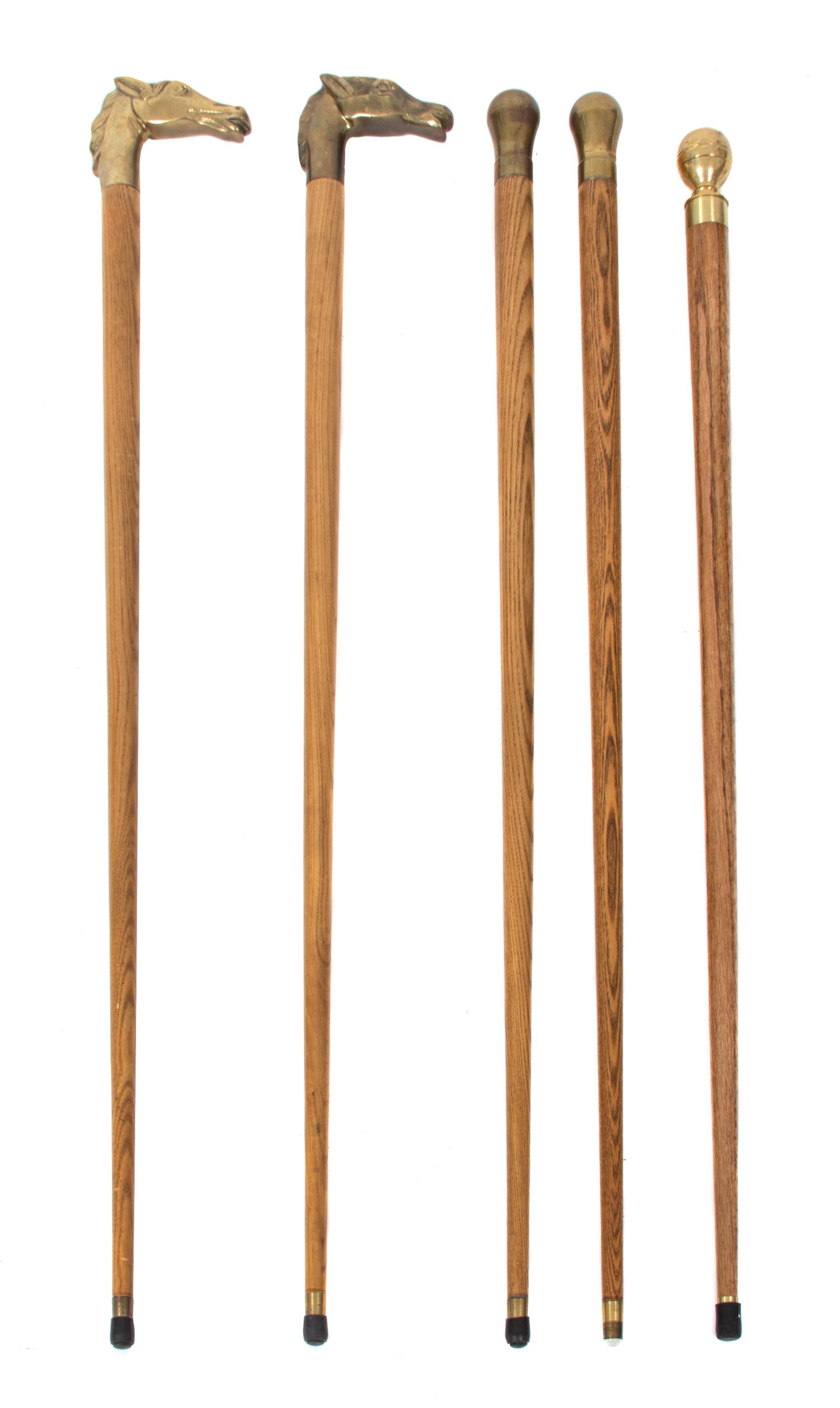 A Collection of Five Brass Handled Ash Canes Length of tallest 35 1/2 inches. — 20TH CENTURY