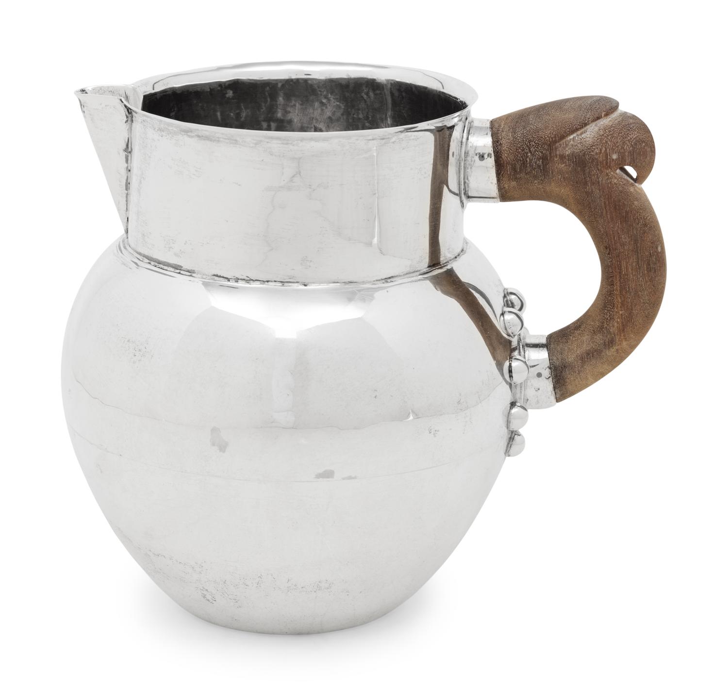 A Mexican Silver Water Pitcher