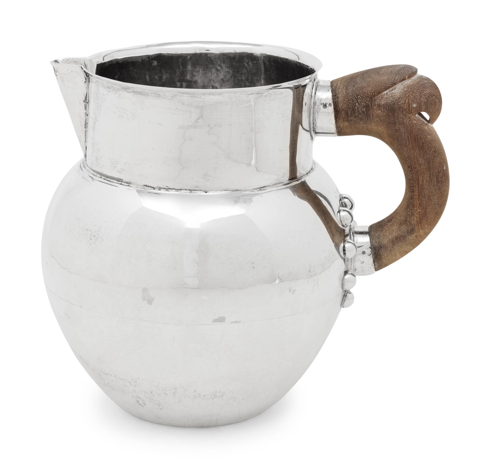 A Mexican Silver Water Pitcher