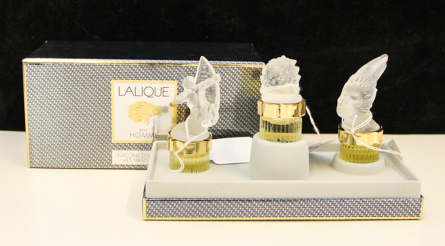 A Group of Three Lalique Frosted Glass Perfume Bottles. Height of tallest 5 1/2 inches.