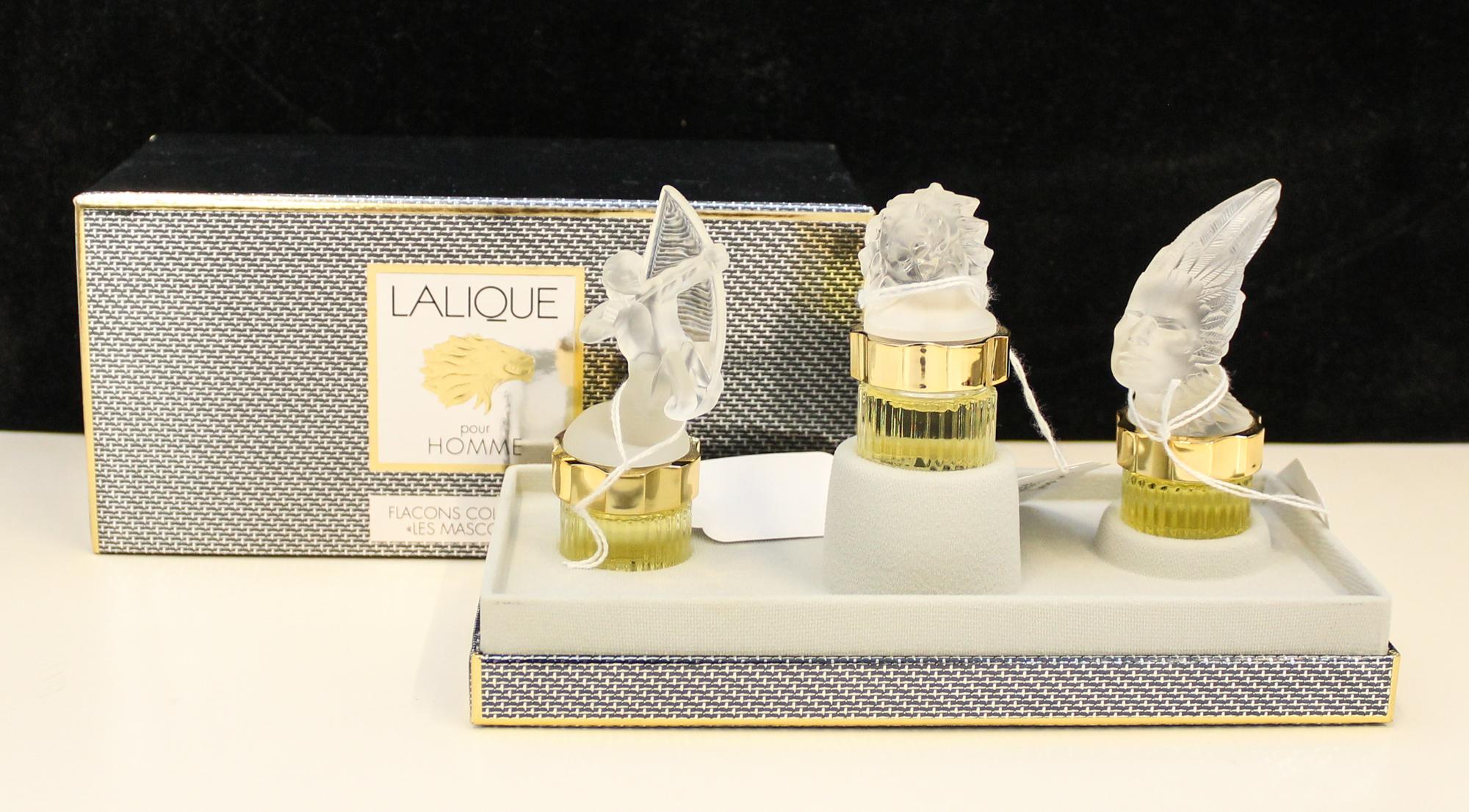A Group of Three Lalique Frosted Glass Perfume Bottles. Height of tallest 5 1/2 inches.