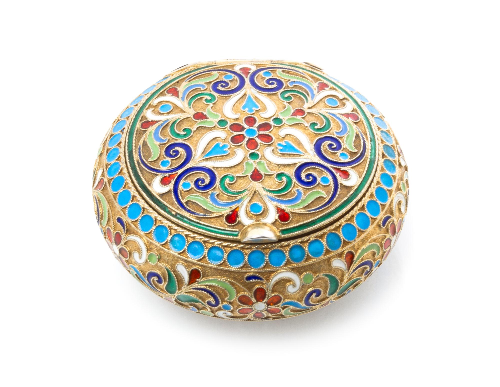 A Russian Silver and Enamel Snuff Box, Maker's mark Cyrillic IX, kokoshnik mark of Ivan Lebedkin, Moscow, of circular form, having a gi