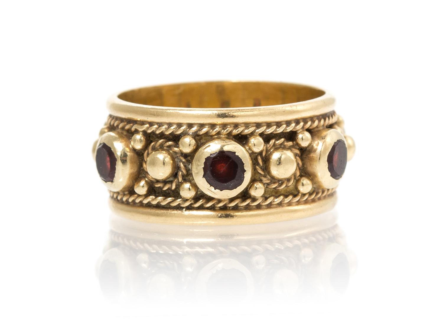 A 14 Karat Yellow Gold and Garnet Ring, 4.50 dwts.