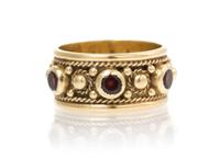 A 14 Karat Yellow Gold and Garnet Ring, 4.50 dwts.