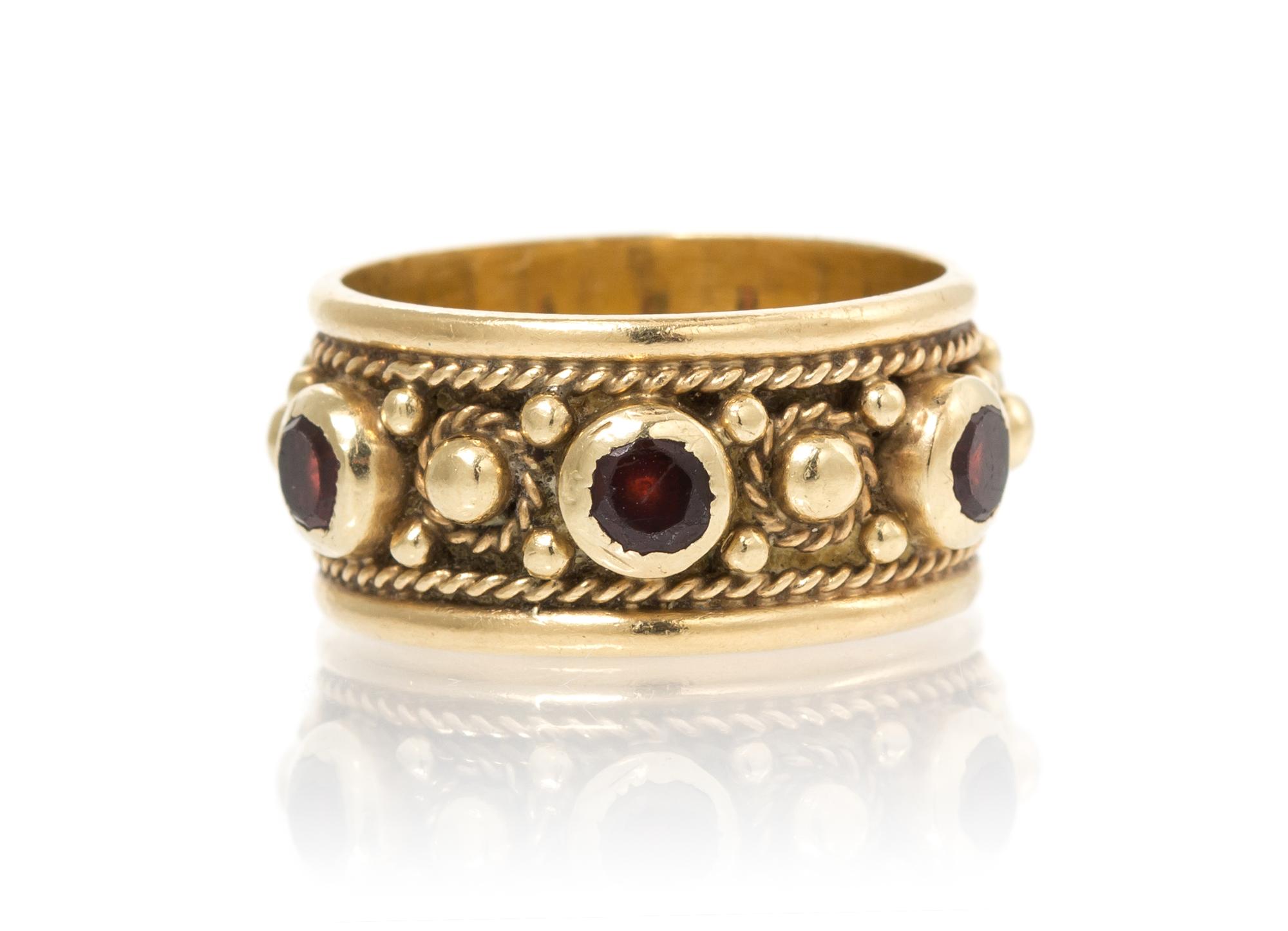 A 14 Karat Yellow Gold and Garnet Ring, 4.50 dwts.
