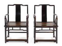 A Pair of Chinese Black Lacquered Elmwood Official's Hat Armchairs, Nanguanmaoyi Height 34 x width 23 1/8 x depth 18 inches. — QING DYNASTY (1644-1911)