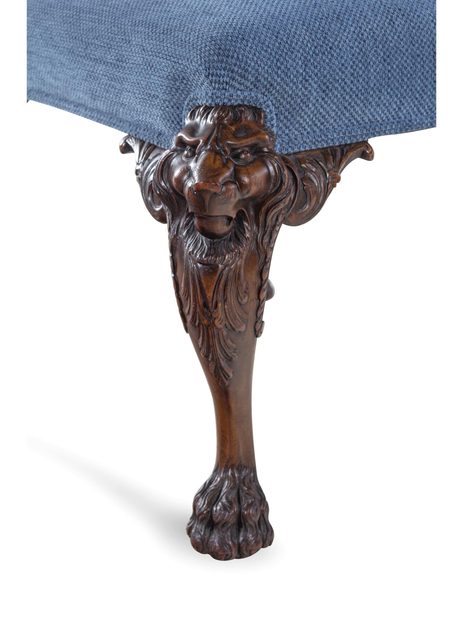 An Edwardian Carved Mahogany Foot Stool