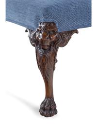 An Edwardian Carved Mahogany Foot Stool