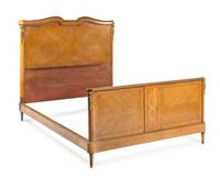 A Louis XVI Style Burlwood and Marquetry Bed Height of headboard 58 1/2 x width 60 1/4 inches. — CIRCA 1900