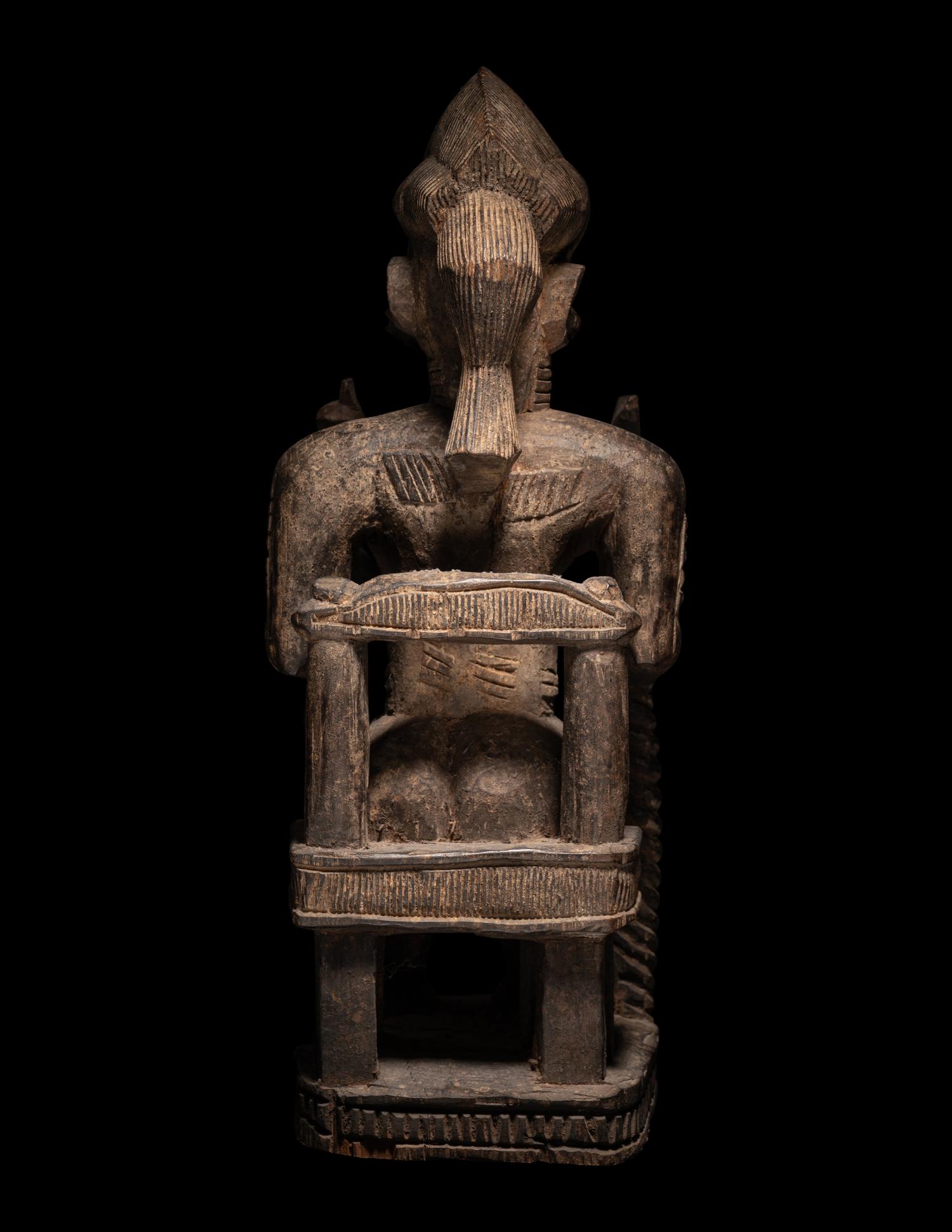 A Baule Wood Seated Male Figure