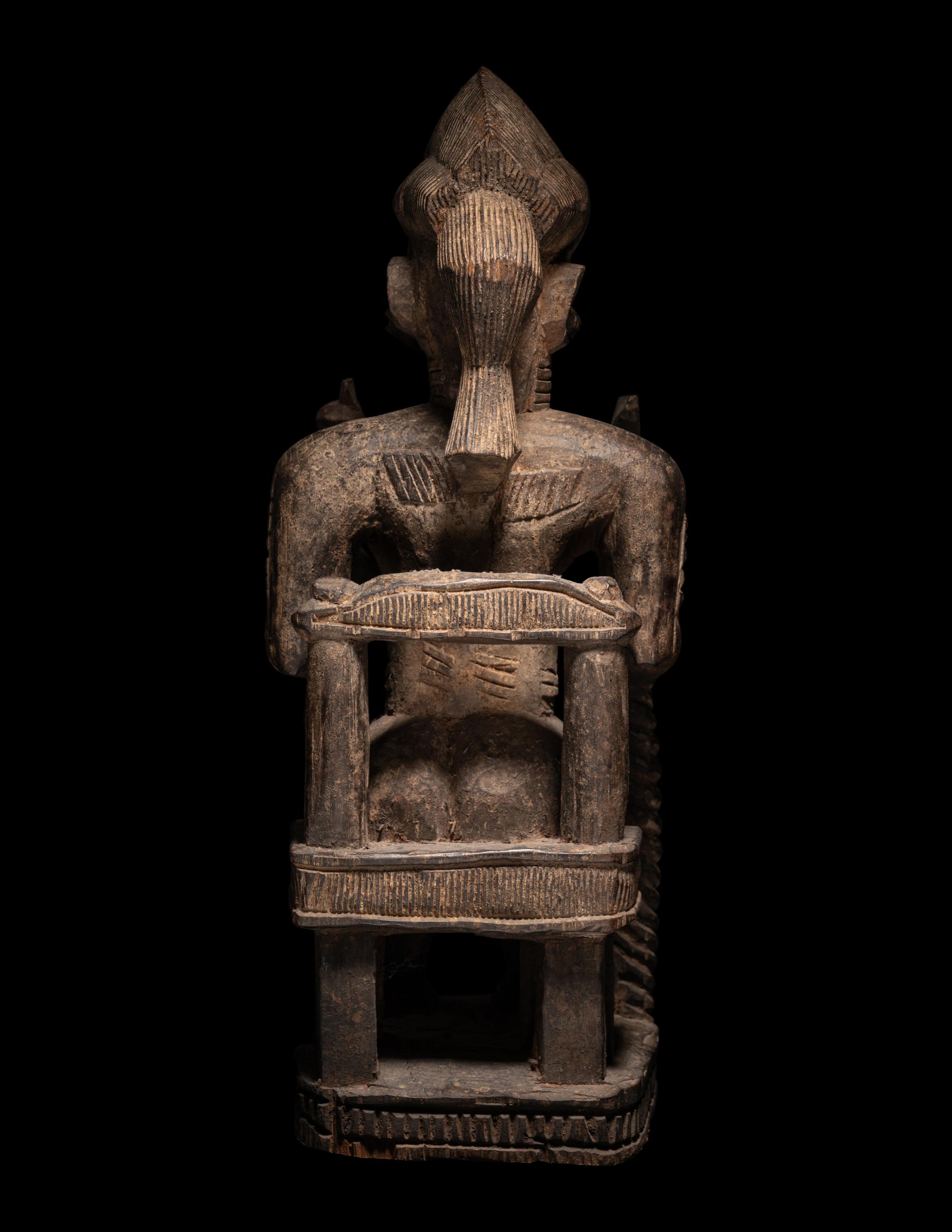 A Baule Wood Seated Male Figure
