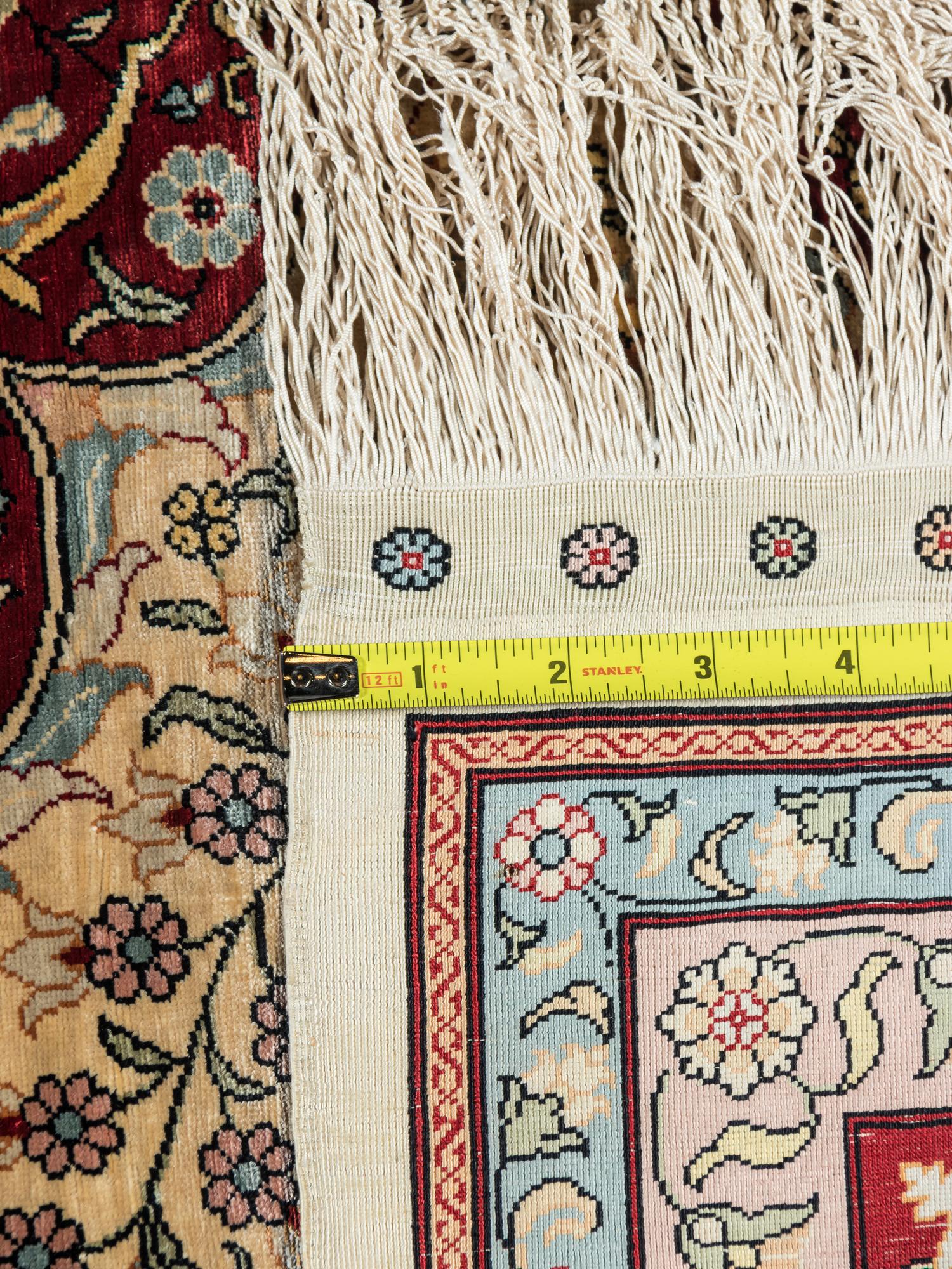 A Signed Tabriz Silk Rug