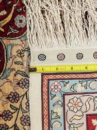 A Signed Tabriz Silk Rug