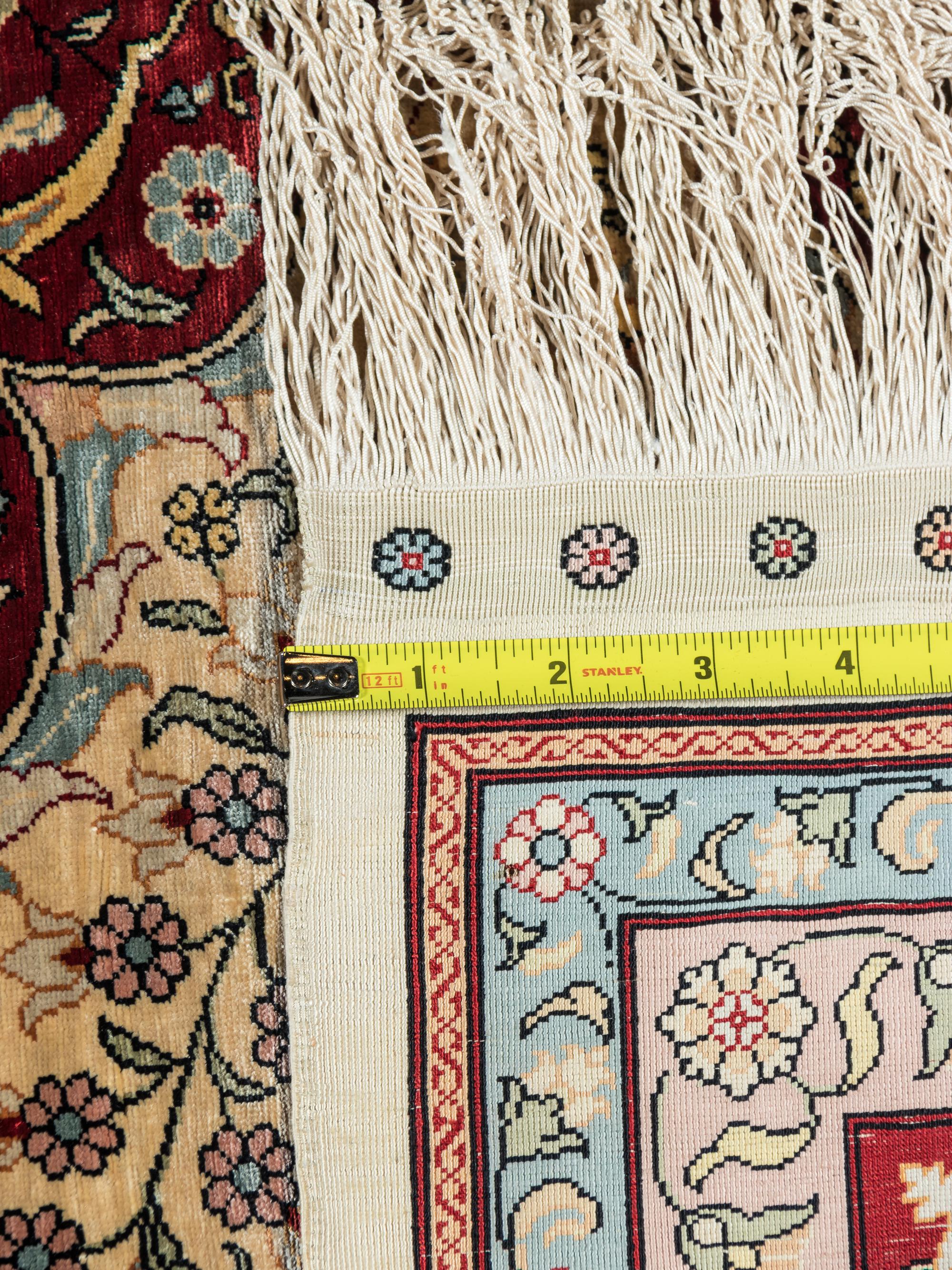 A Signed Tabriz Silk Rug