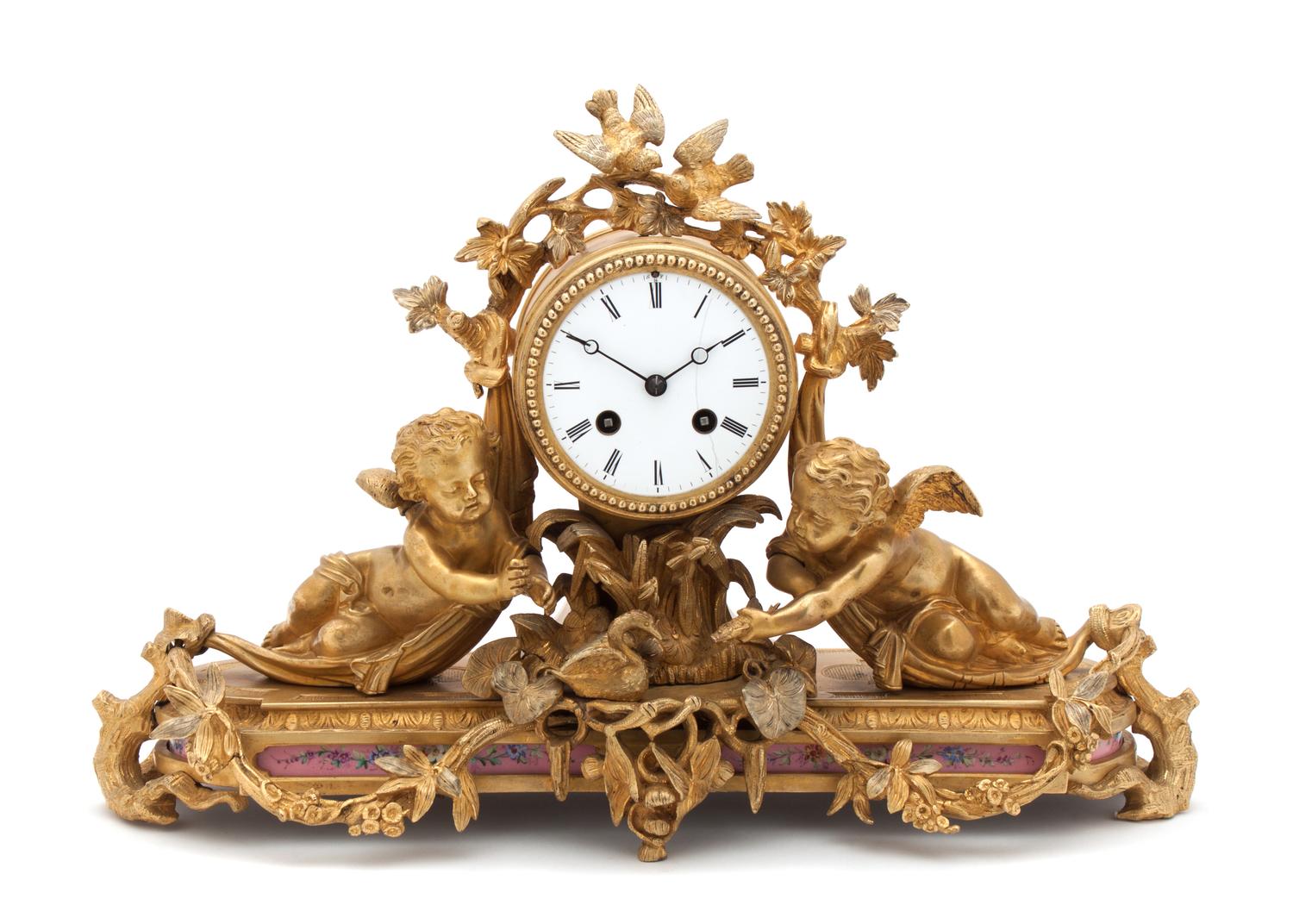 A French Gilt Bronze Figural Mantle Clock Width 18 inches. — 19TH/20TH CENTURY