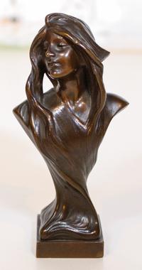 An Art Nouveau Bronze Bust. Height 5 1/4 inches.