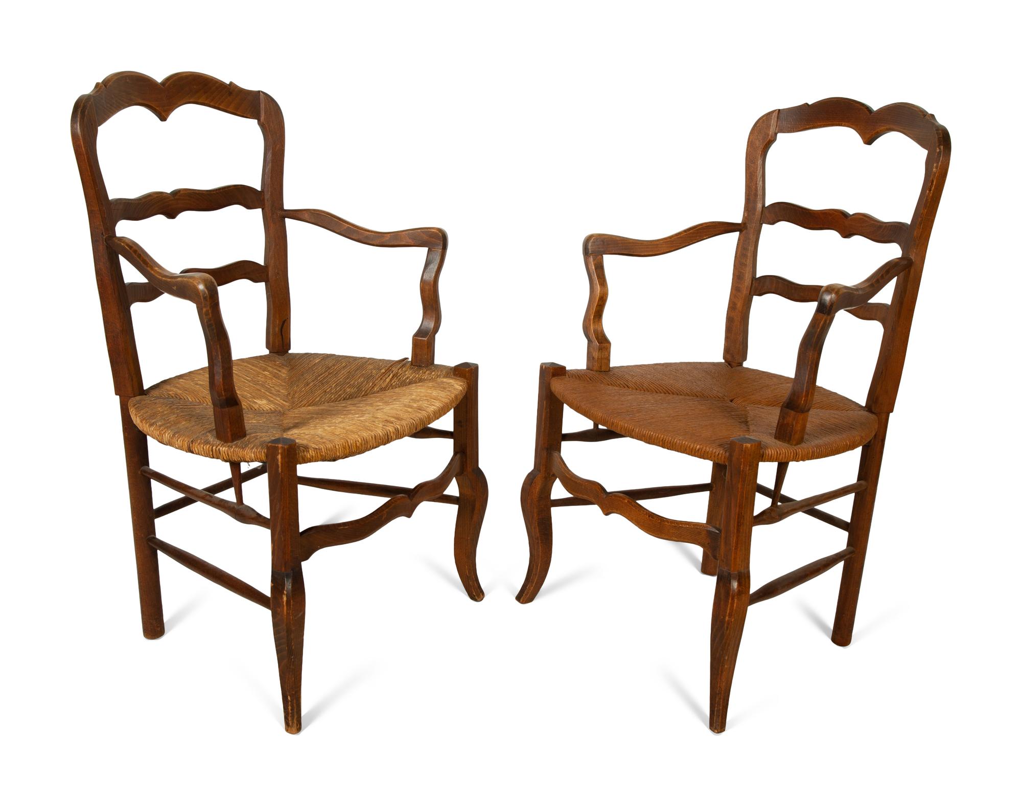A Set of Four French Provincial Style Walnut Dining Chairs