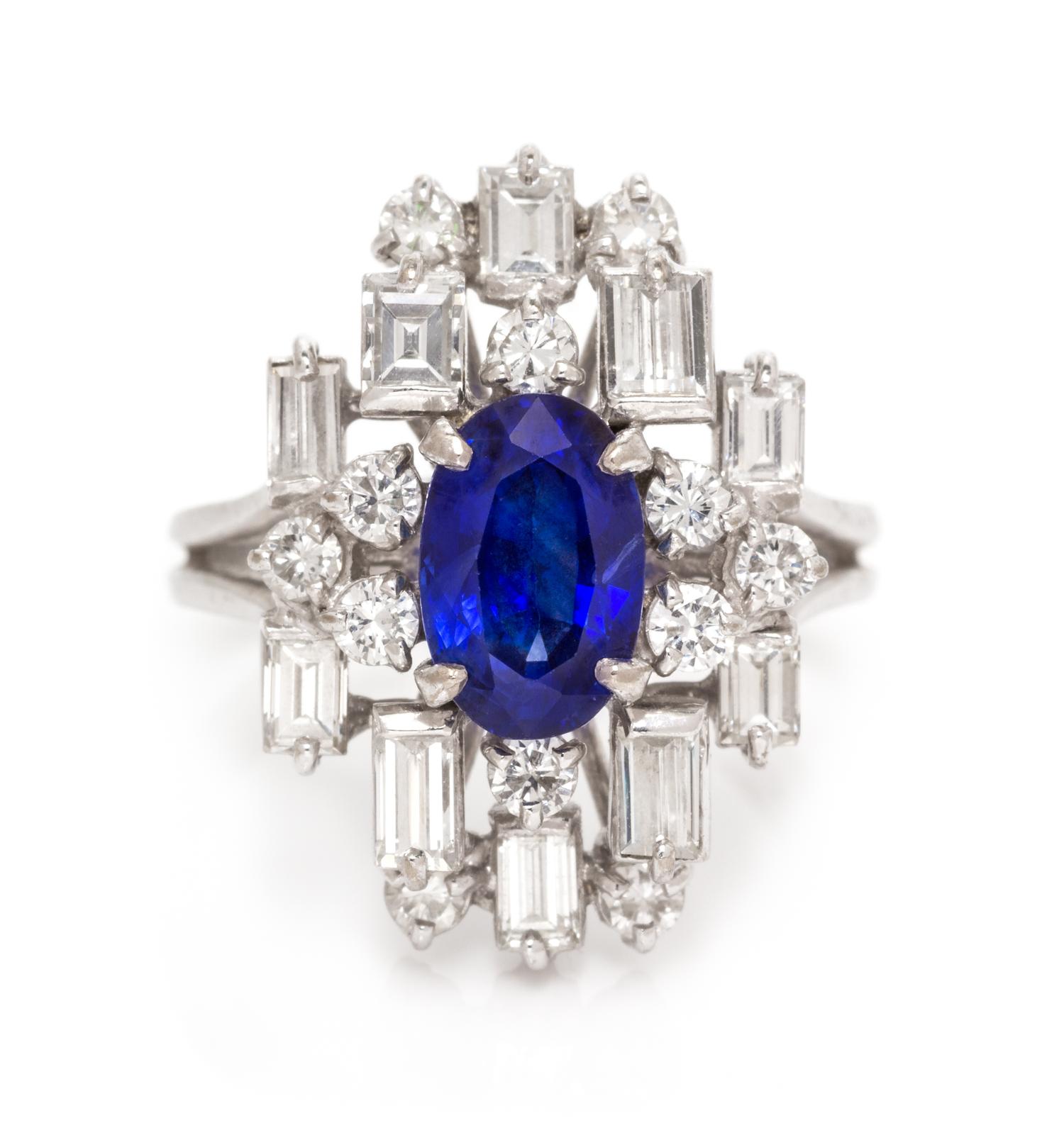 An 18 Karat White Gold, Sapphire and Diamond Ring, 5.20 dwts.