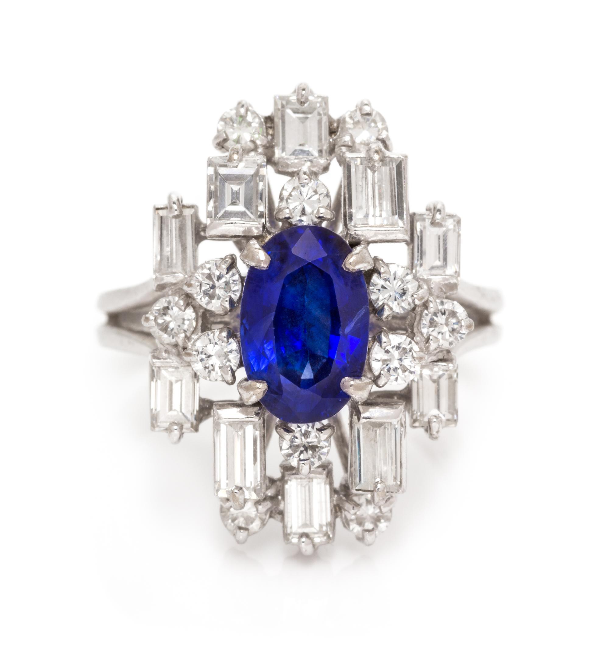 An 18 Karat White Gold, Sapphire and Diamond Ring, 5.20 dwts.