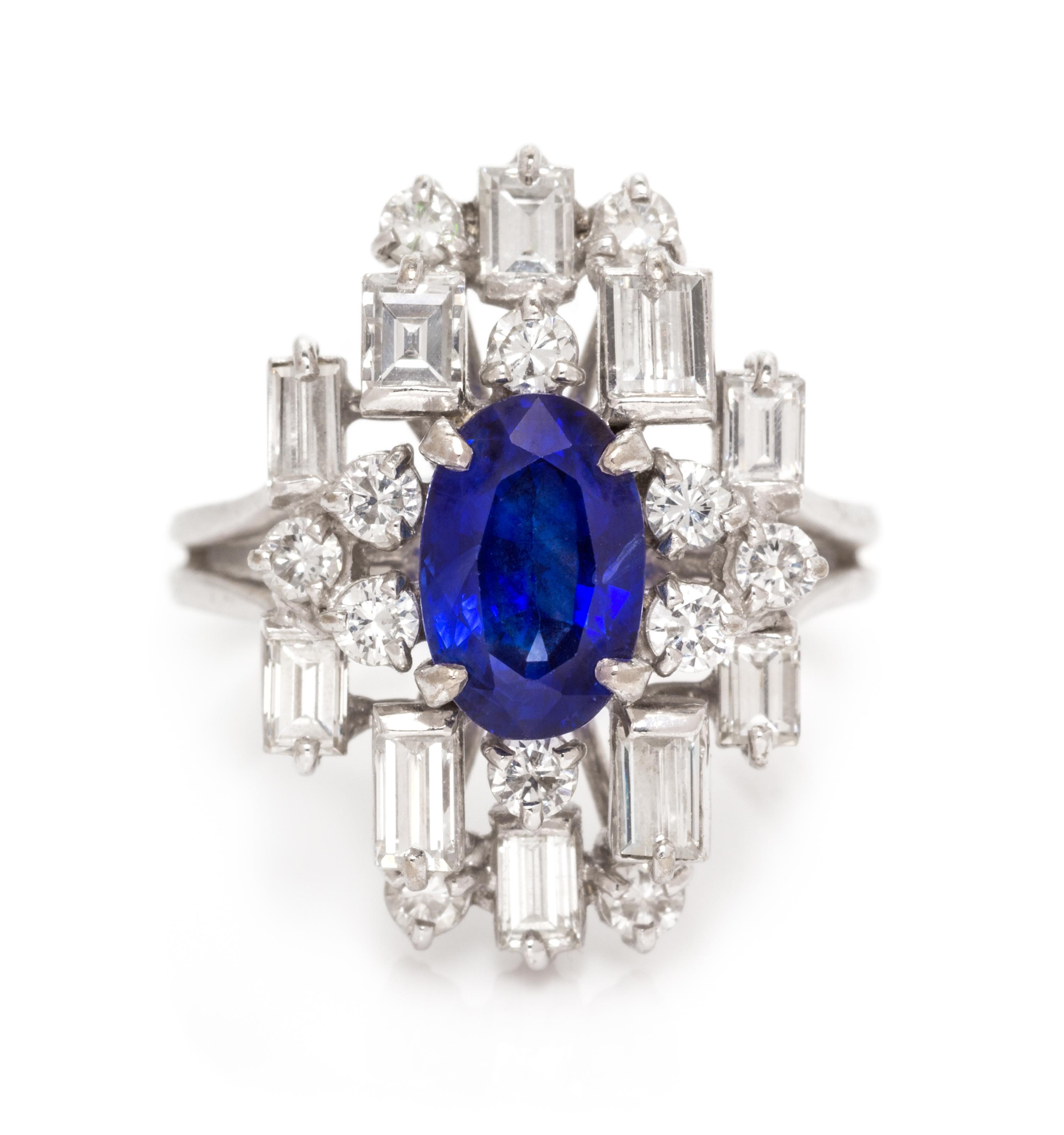 An 18 Karat White Gold, Sapphire and Diamond Ring, 5.20 dwts.