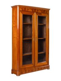 A Biedermeier Figured Walnut Two-Door Bookcase