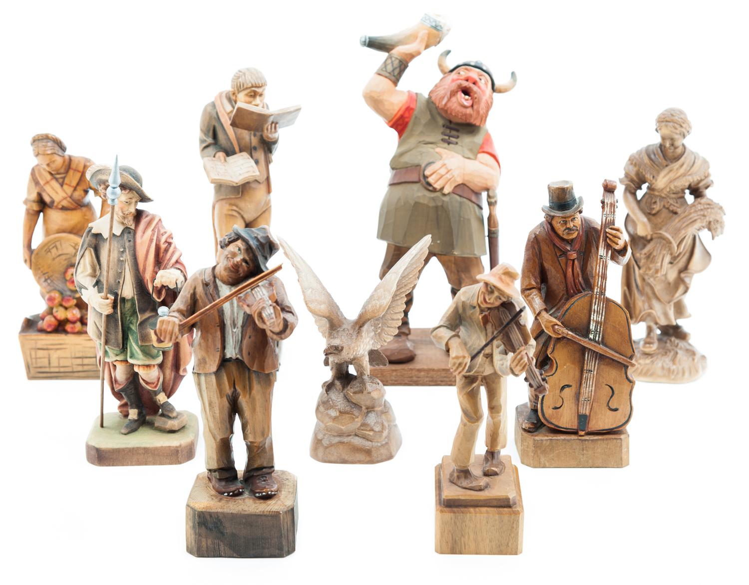A Group of Nine Carved Wood Figures Height of tallest 10 1/4 inches.