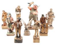 A Group of Nine Carved Wood Figures Height of tallest 10 1/4 inches.