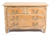 A Provincial Style Carved and Distressed Finish Chest of Drawers height 34 x width 50 1/2 x depth 21 inches. — 20TH CENTURY