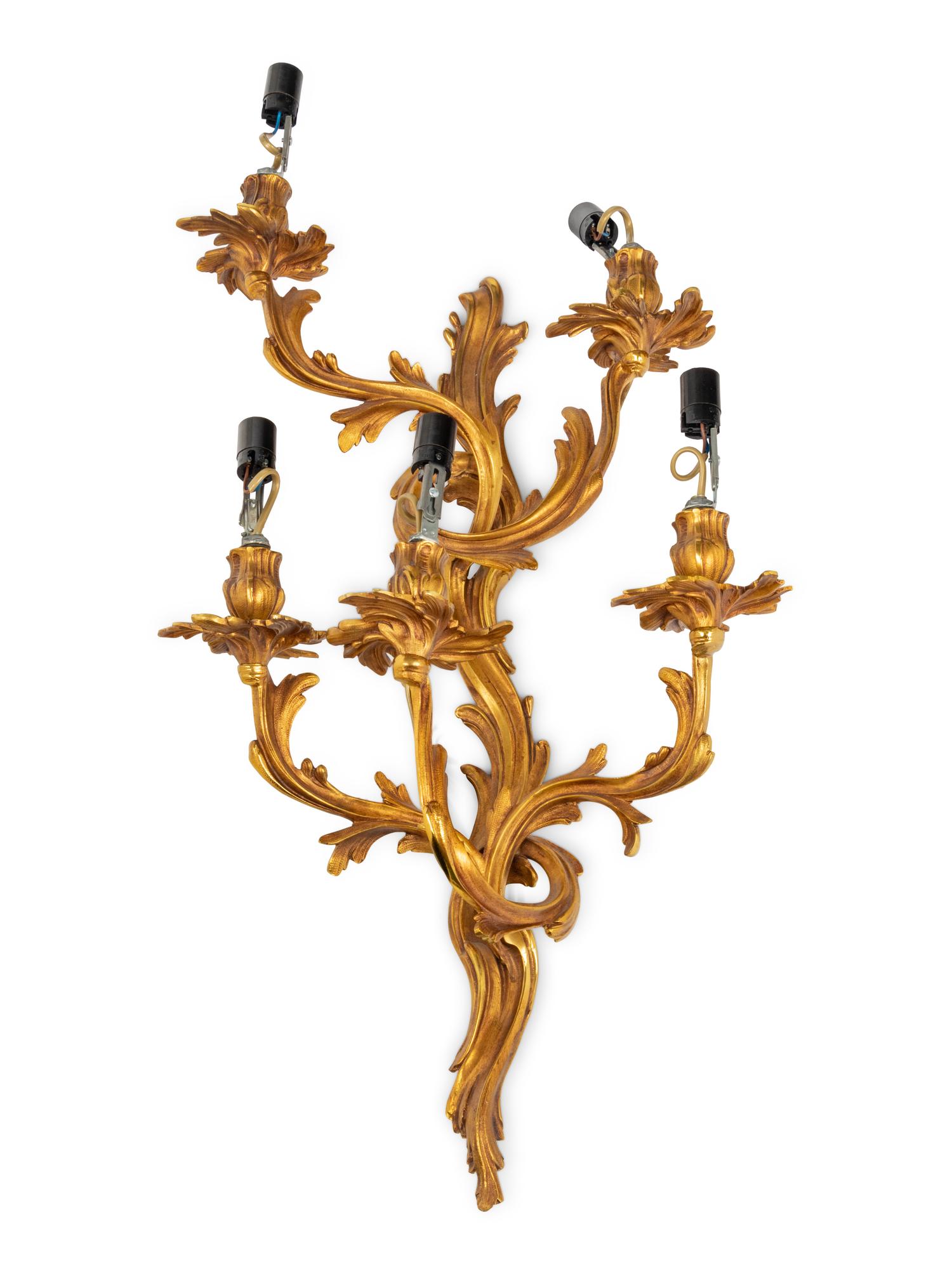A Set of Four Louis XV Style Gilt Metal Five-Light Sconces