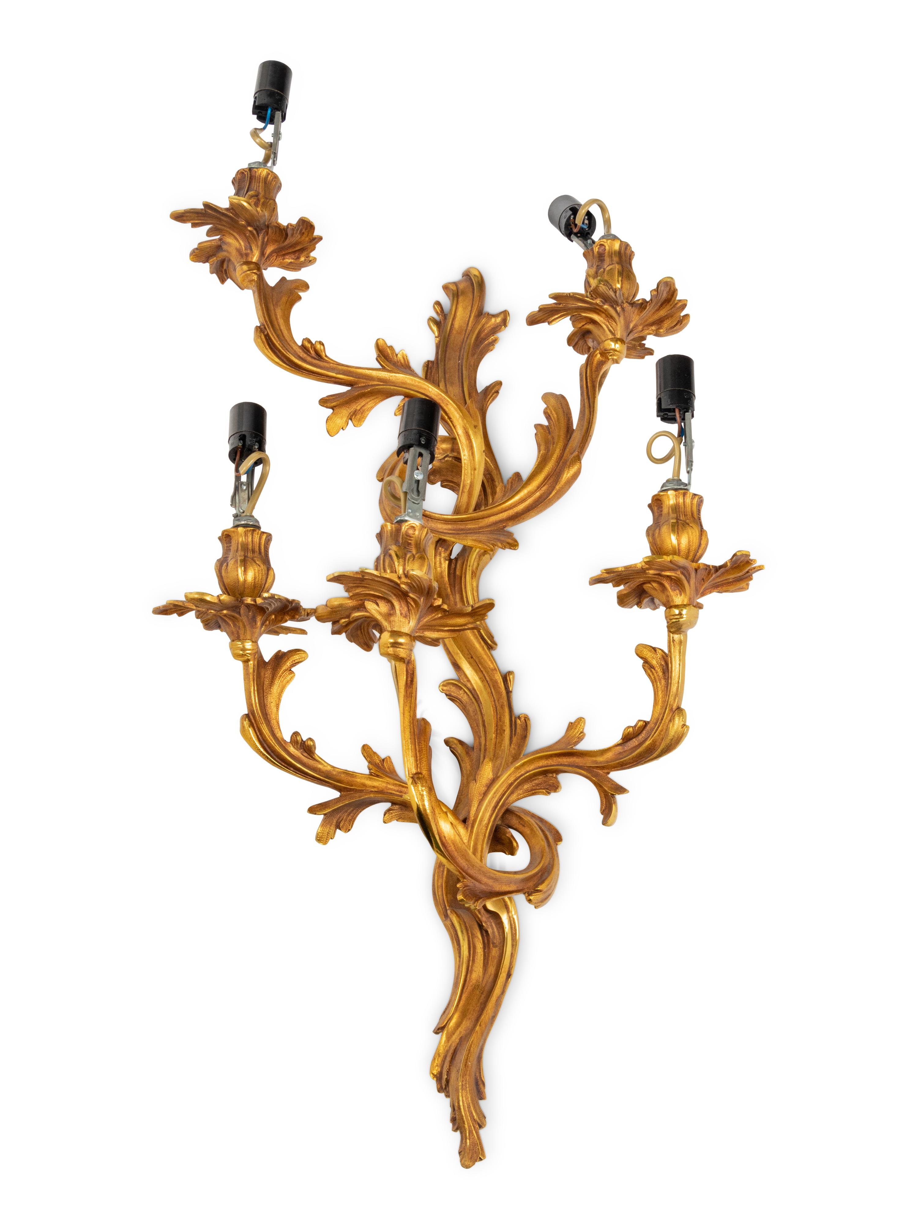 A Set of Four Louis XV Style Gilt Metal Five-Light Sconces