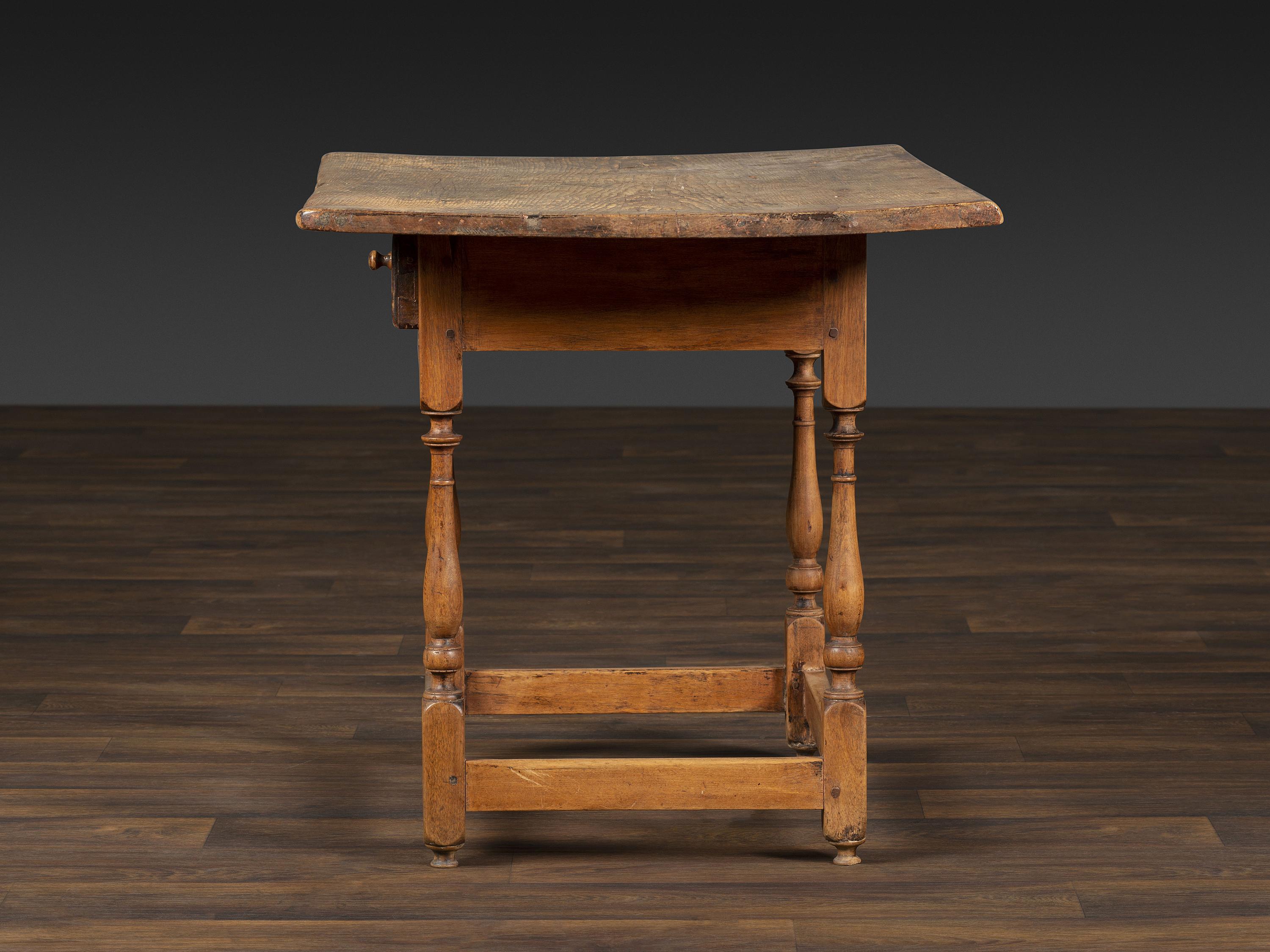 A William and Mary Pine and Maple Scrubbed Top Tavern Table