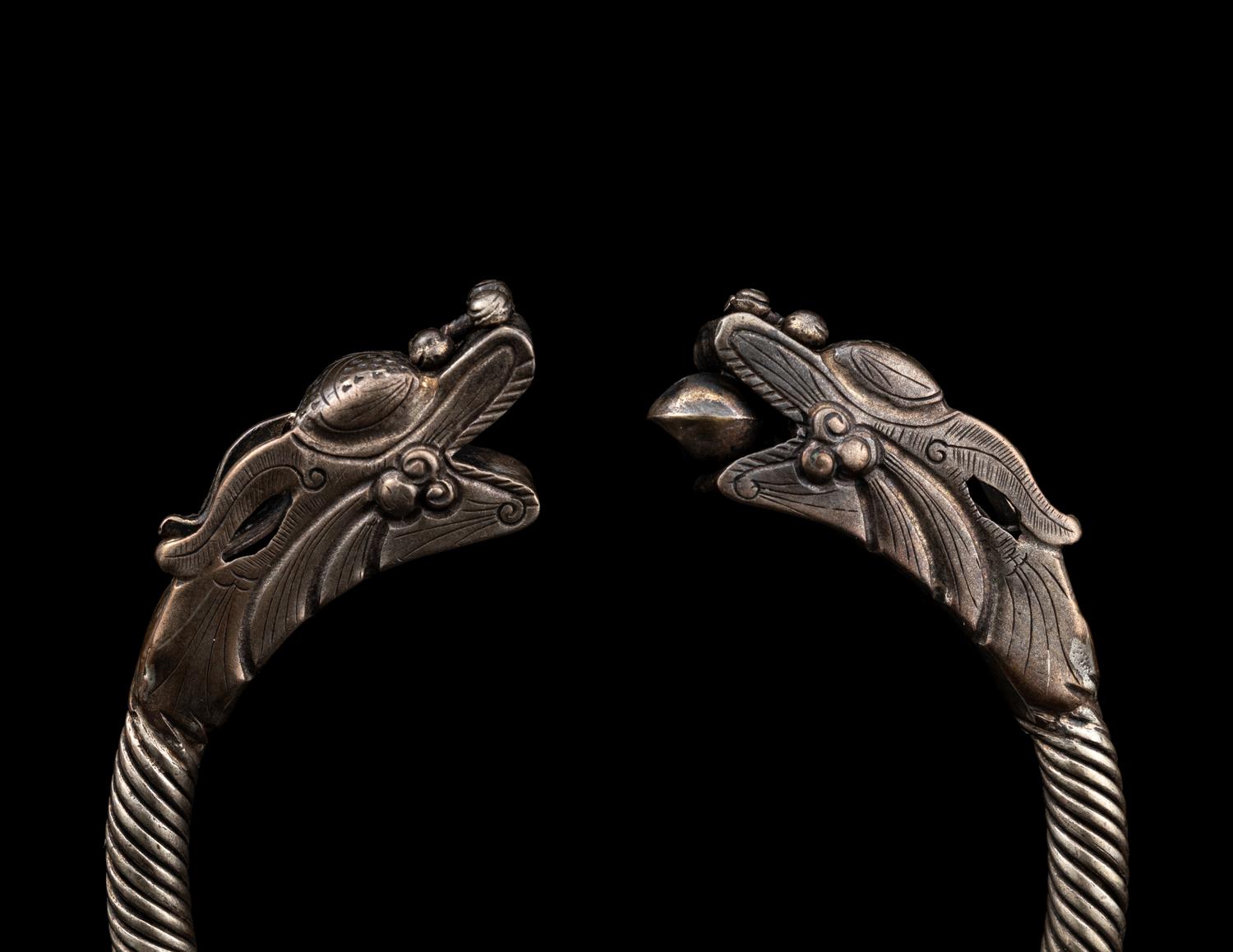 A Pair of Chinese Silver 'Dragon' Bangles