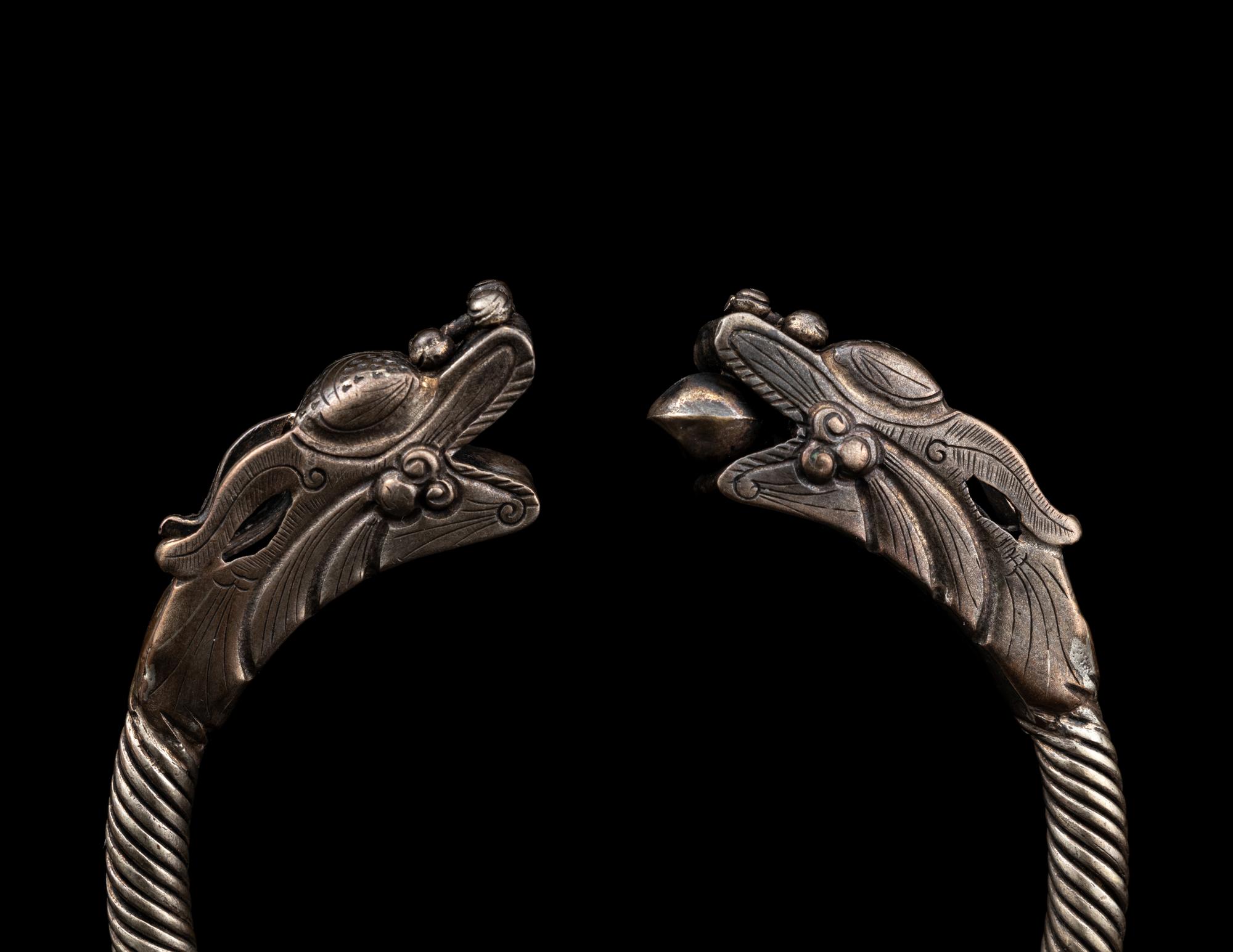 A Pair of Chinese Silver 'Dragon' Bangles