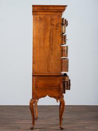 A Queen Anne Shell-Carved and Figured Maple Flat-Top High Chest of Drawers