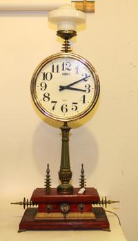 An Assembled Table Clock Height 43 1/2 inches (without shade). — JOHN ANTON