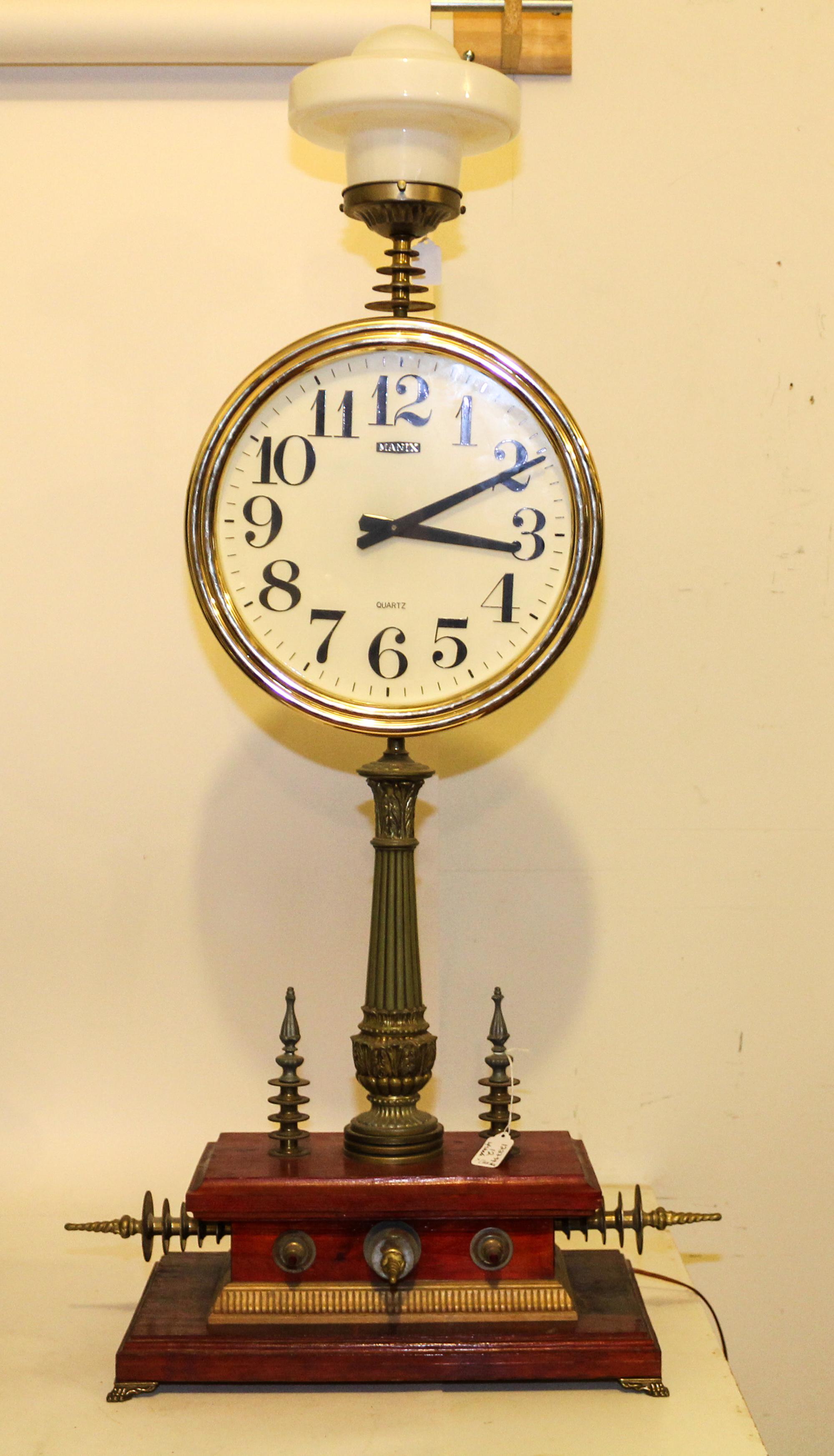 An Assembled Table Clock Height 43 1/2 inches (without shade). — JOHN ANTON