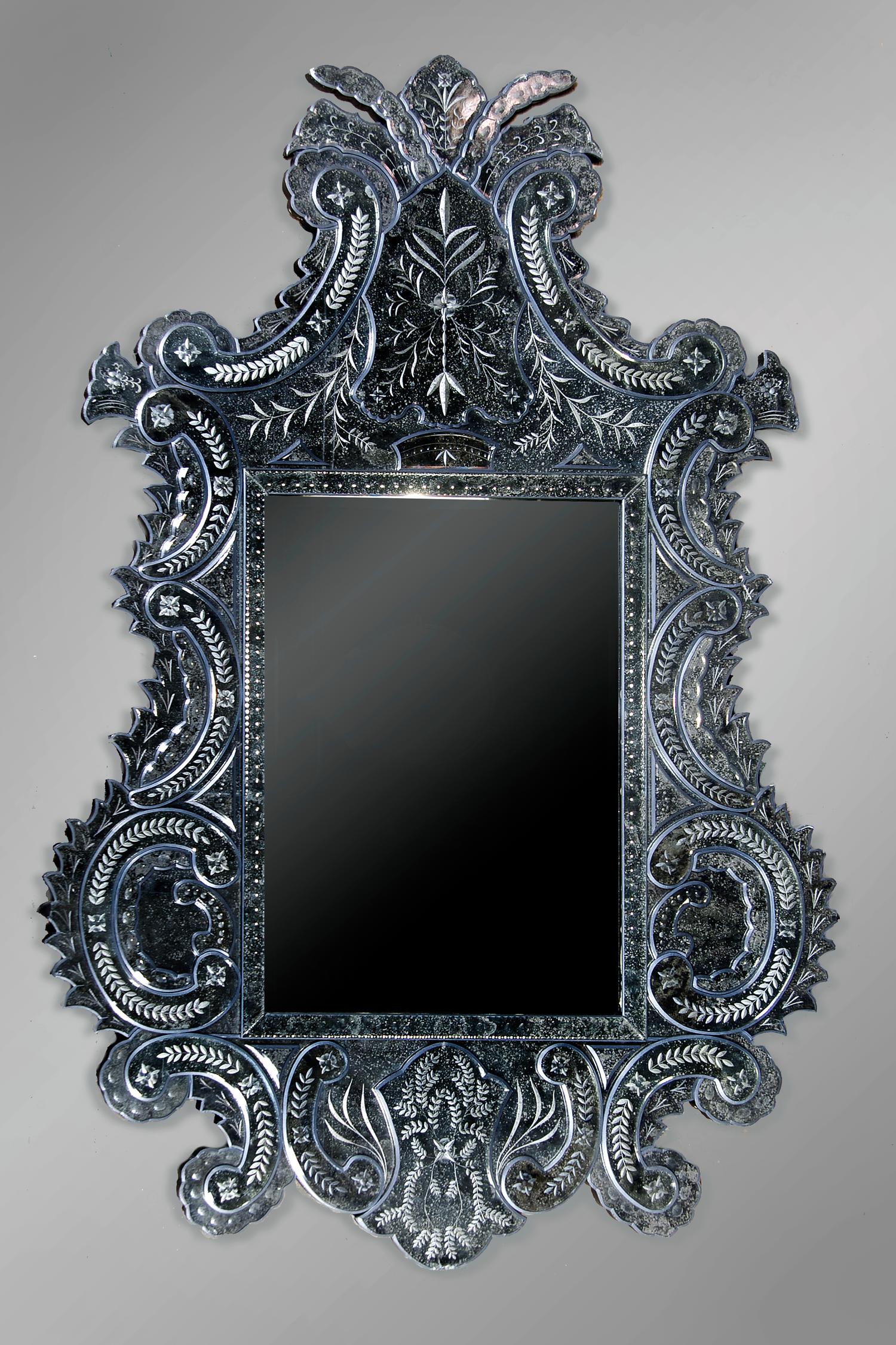 A Venetian Glass Mirror, Height 74 x width 49 1/2 inches.