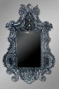 A Venetian Glass Mirror, Height 74 x width 49 1/2 inches.