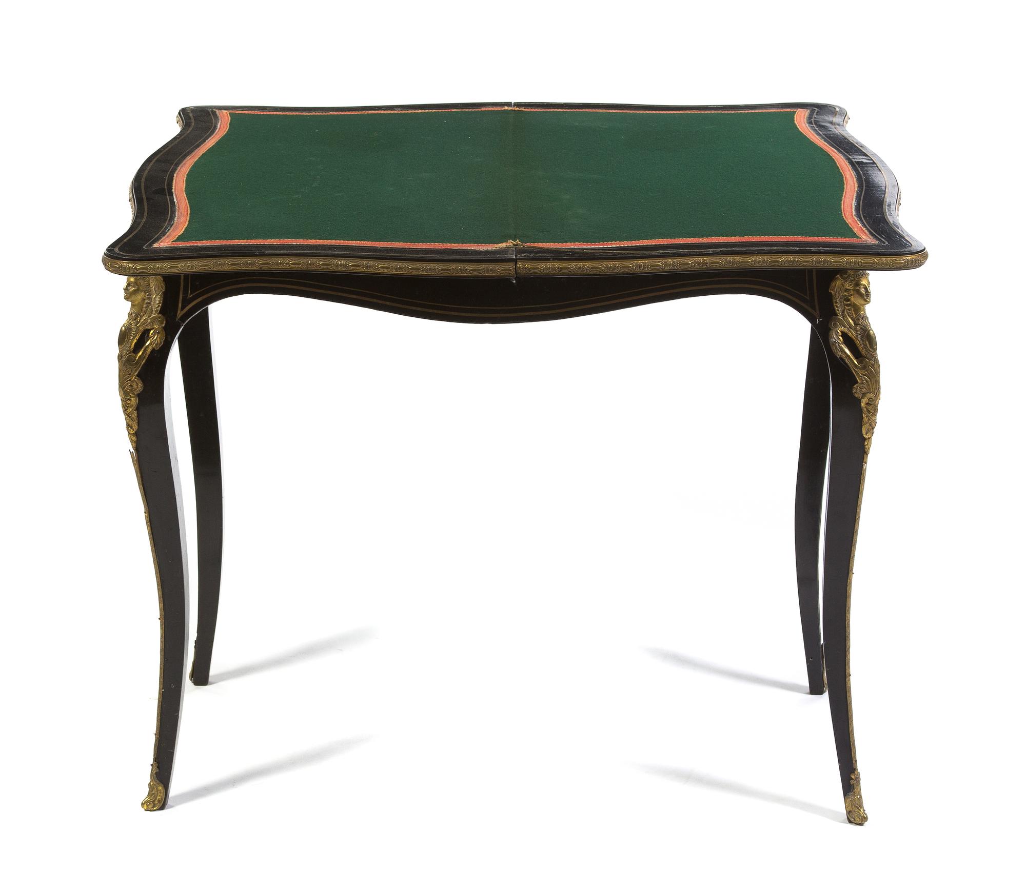 A Napoleon III Ebonized and Gilt Metal Mounted Games Table, Height 29 x width 33 x depth 16 5/8 inches (closed).