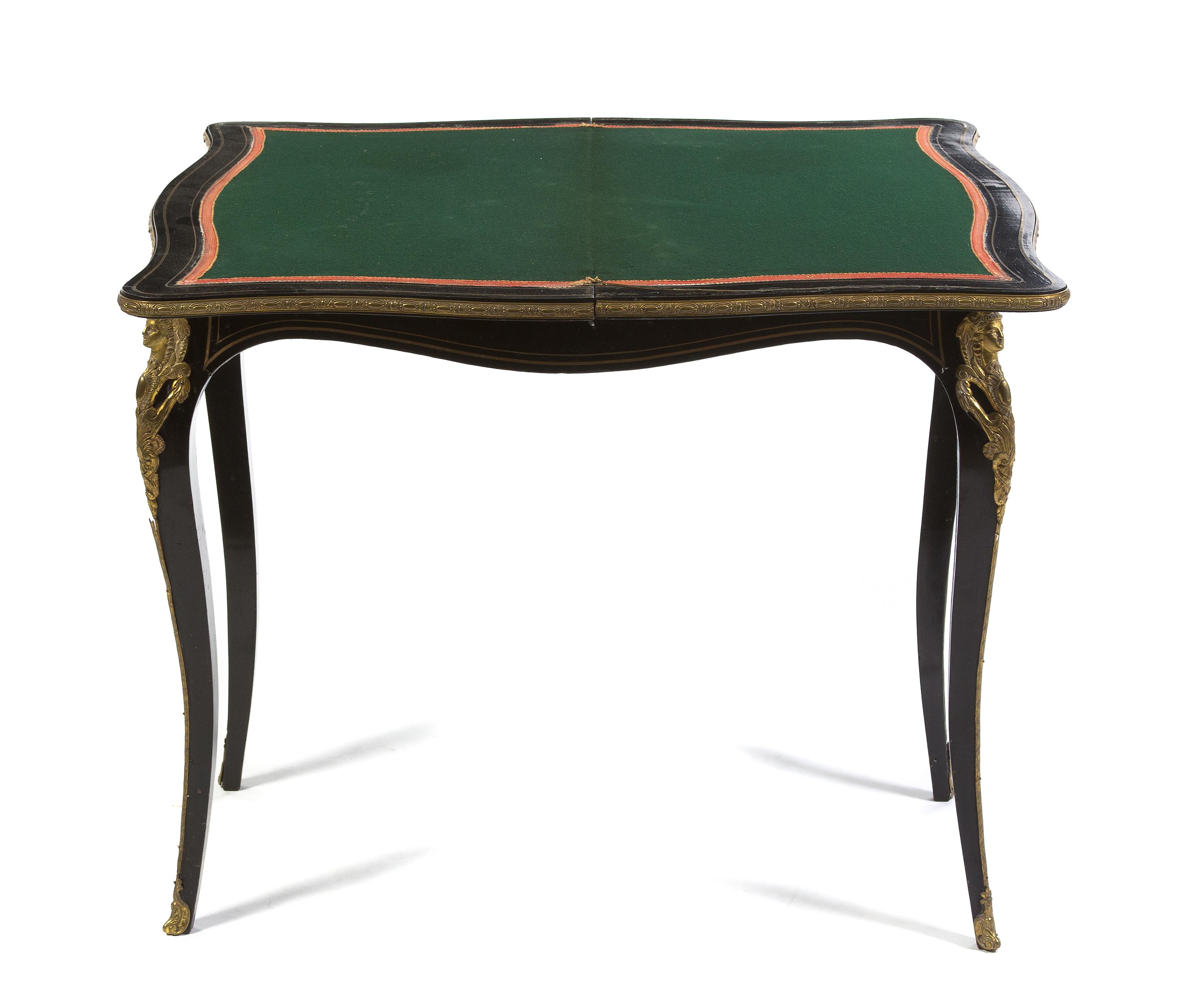 A Napoleon III Ebonized and Gilt Metal Mounted Games Table, Height 29 x width 33 x depth 16 5/8 inches (closed).