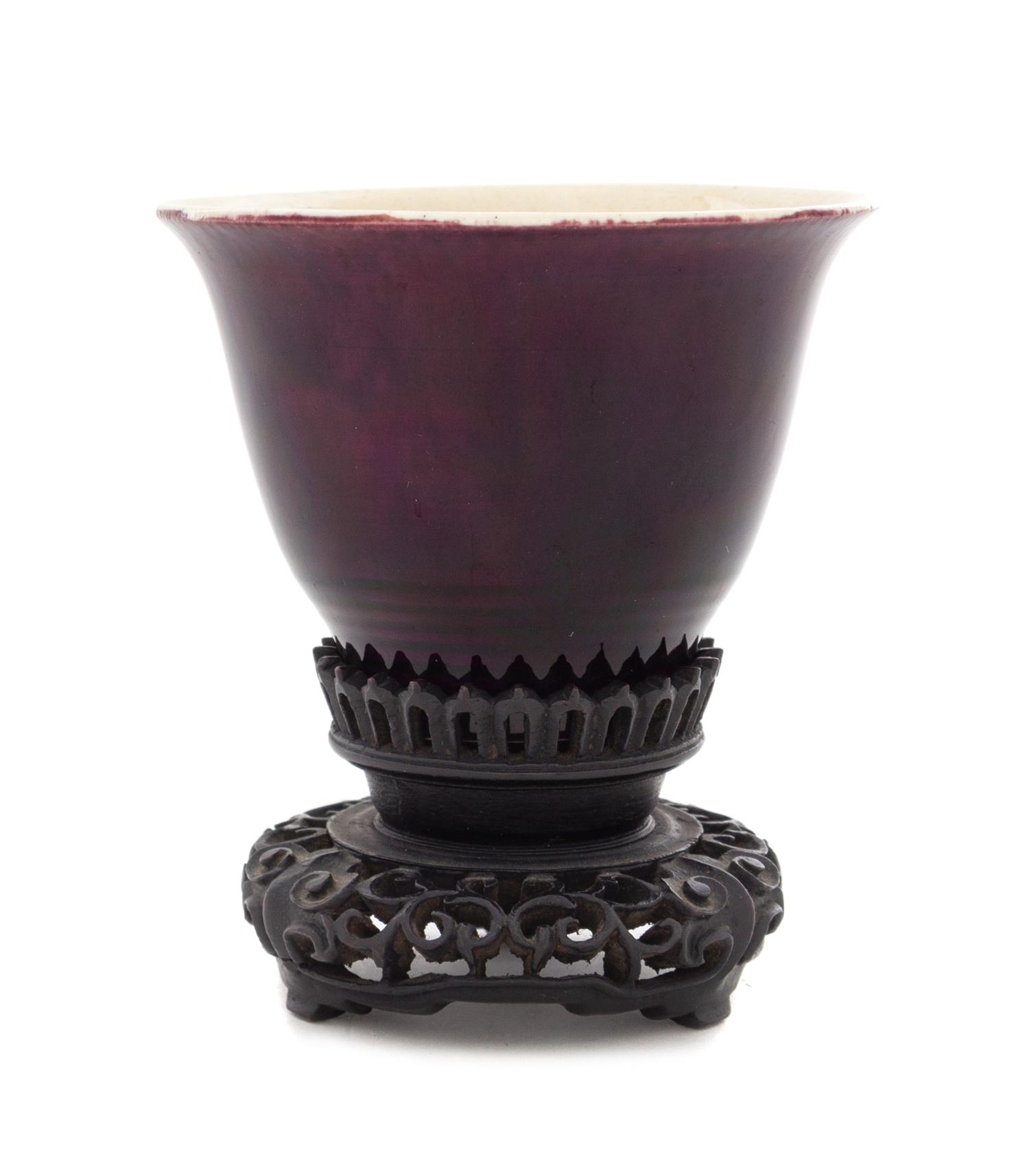 A Chinese Aubergine Glazed Porcelain Cup Height 2 1/2 inches. — 19TH CENTURY