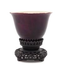 A Chinese Aubergine Glazed Porcelain Cup Height 2 1/2 inches. — 19TH CENTURY