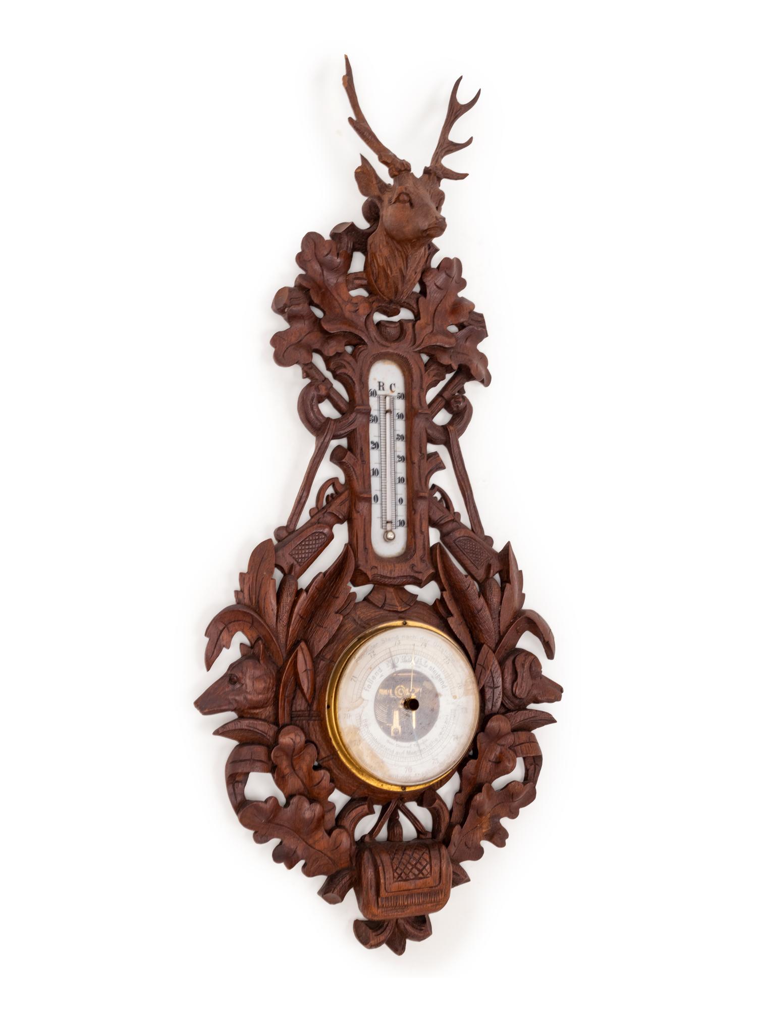 A Black Forest Carved Barometer and Thermometer
